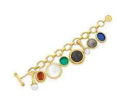 Elizabeth Taylor's Impressive Jewelry Collection -A gold-and-multi-gem charm bracelet - Natural Blue Sapphires