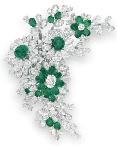 Elizabeth Taylor's Impressive Jewelry Collection- An emerald-and-diamond pendant brooch, by Bulgari, 1958, gift from Richard Burton - Natural Blue Sapphires